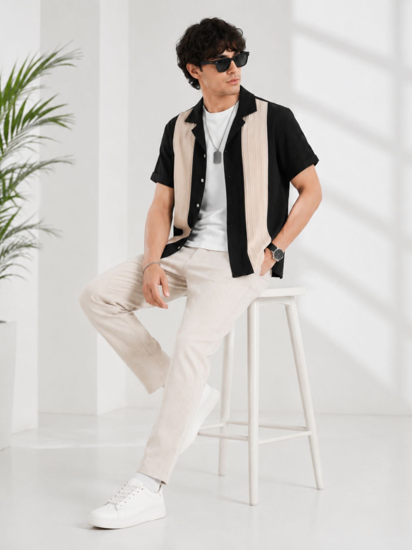 Black_and_Sand_Half_Sleeve_Performance_Shirt_seated_on_stool